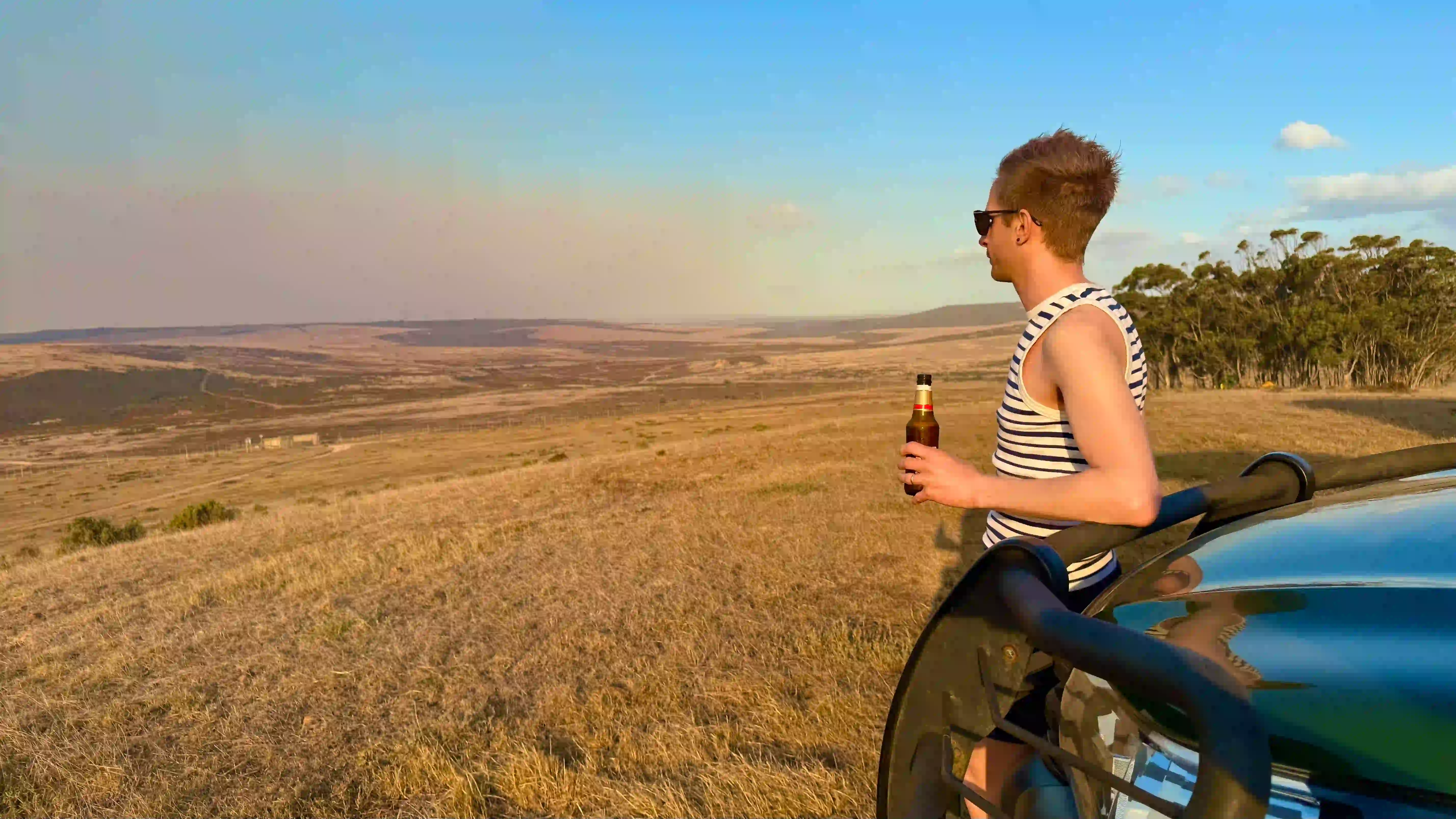 Warm lighting over a travel planning desk
